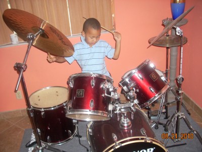 My son's first exposure to drums on a trip in 2010.