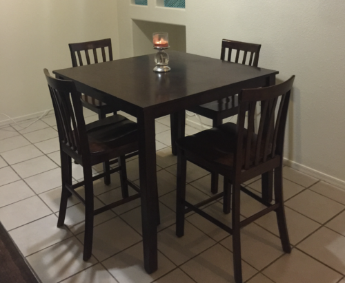 small square kitchen table with four chairs