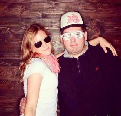 Photograph of Adam and Emily Dawson blogging away debt authors.